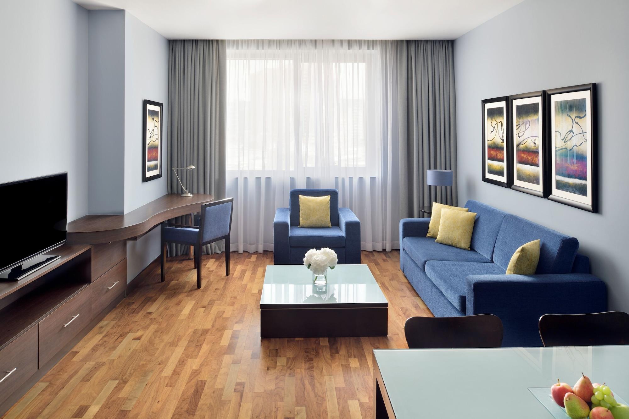 モーベンピック ホテル アパートメンツ アル マンザー ドバイ エクステリア 写真 A typical living room